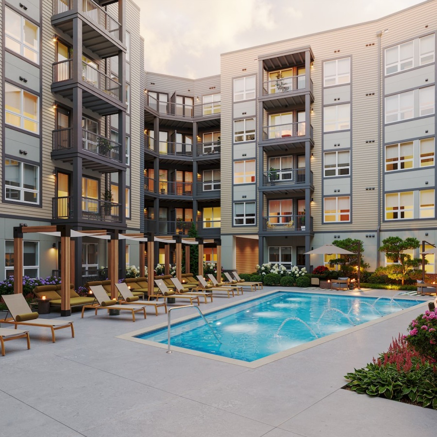 a courtyard with a pool and chairs