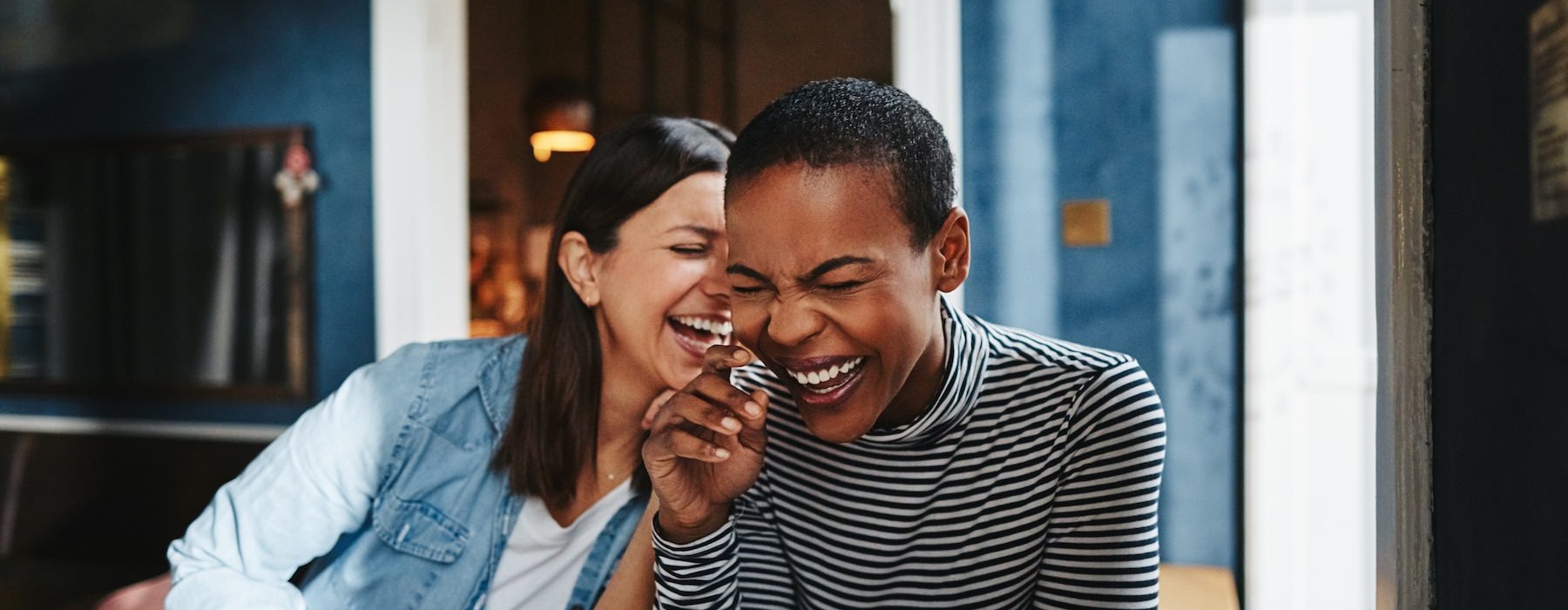 two women laughing
